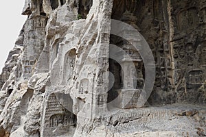 A pagoda is carved into the rock, and many of the exquisite Buddha statues are embossed on the rocks