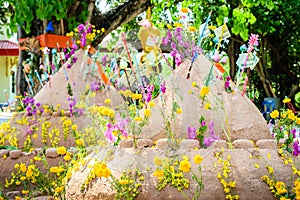 Pagoda and flower on sand in Songkran day festival , Thailand.