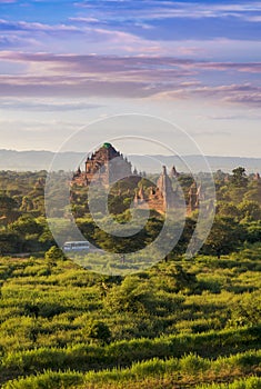 Pagoda landscape of Bagan in misty morning under a warm sunrise in the plain of Bagan Myanmar.