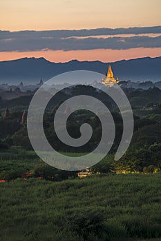 Pagoda landscape of Bagan in misty morning,under a warm sunrise in the plain of Bagan.