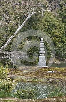 A pagoda made of stone in the park of the Golden pavilion.