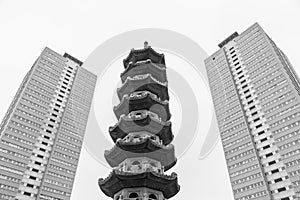 Chinese pagoda between two old blocks of flats photo