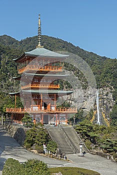 Scenic view of pagoda of Seiganto-ji Temple with Nachi no Taki waterfall in background at Nachi Katsuura, Wakayama, Japan