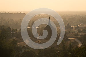 Pagodas and monastery on hill at sunset, north Mrauk U, Rakhine