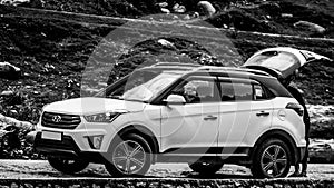Pahalgam, Jammu & Kashmir, India- Date: July 16, 2018- Black and white shot of a Hyundai Creta SUV car on a road