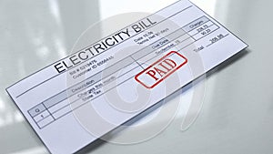 Paid seal stamped on electricity bill, payment for services, month expenses