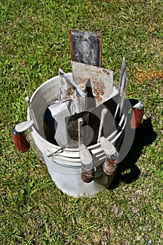 Pail of trowels used for concrete work