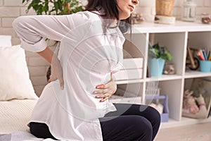 Pain in abdomen of pregnant woman, birth pangs before birth