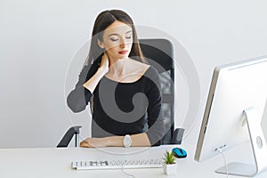 Pain. Business Woman suffering from a neck pain from bad posture