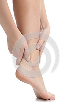 Pain concept with a woman hands catching ankle