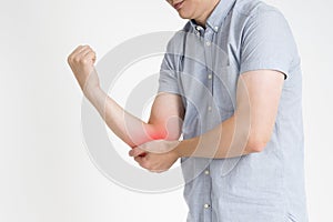 Pain in elbow, joint inflammation with red dot on gray background