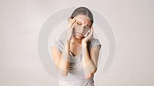 Pain and fever. Beautiful young woman feeling sick and tired. Woman having headache and high fever. The girl suffers from painful