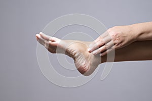 Pain in the foot. Massage of female feet
