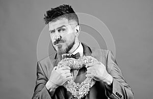 pain in heart. businessman in bow tie has heart problems. Love. Wedding day. stylish esthete with decorative heart