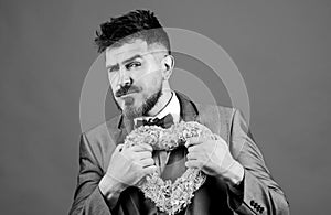 pain in heart. businessman in bow tie has heart problems. Love. Wedding day. stylish esthete with decorative heart