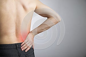 Pain in the lower back in men photo