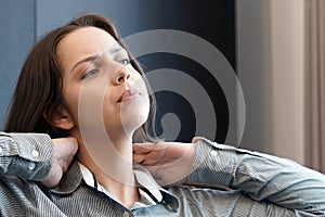 Pain in the neck of a woman from fatigue