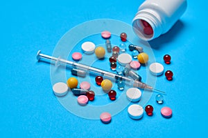 pain reliever vitamins capsules medicine blue background