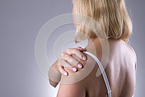 Pain in shoulder, care of female hands, ache in woman`s body