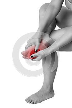 Pain in woman`s legs, massage of female feet isolated on white background