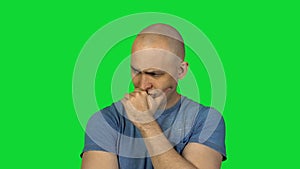 Pained bald man on green background