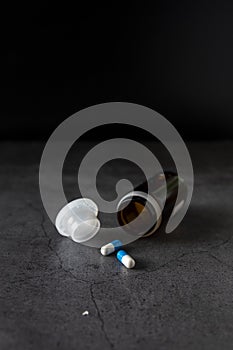 Painkiller pills on a dark background