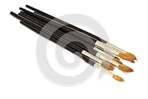 Paint brush with black handle closeup isolated on white background