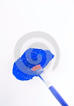 Paint brush and blue blot