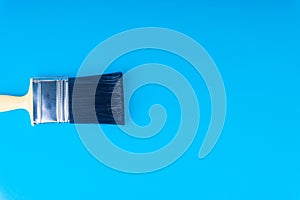 Paint brush on blue colour background