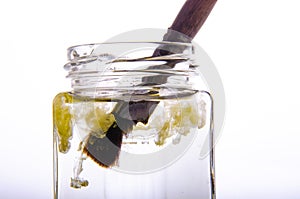 Paint brush in a can and a cloud of paint in water. White background.