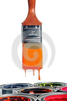 Paint Brush Dripping Over Open Cans