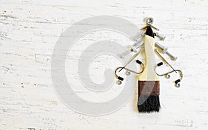 Paint brush and nuts and bolts decorated as christmas tree on a