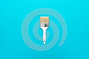 Paint brush on the turquoise blue background