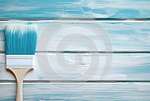Paint brush on a white and blue wooden background