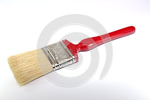 Paint brush width 2 inches with a red handle on a white background