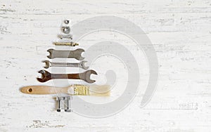 Paint brush wrench, nuts and bolts decorated as christmas tree o