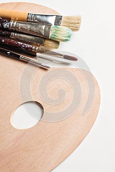 Paint brushes on a clean pallette