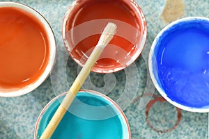 Paint brushes and crafting supplies on the table