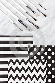 Paint brushes and decorative paper for arts and crafts
