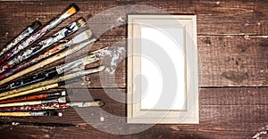 Paint brushes and photo frame