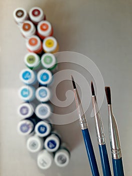 Paint brushes. Photography tools for fine art and pictorial art. Brush painting on canvas in orange tones.  Examples of color