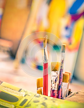 Paint Brushes in a vintage colorful Atelier photo