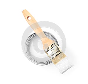 Paint can with brush on white background