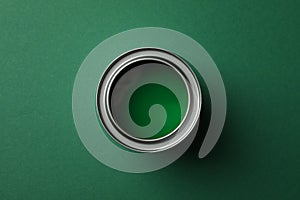 Paint can on green background