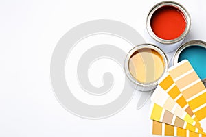 Paint cans and color palette on white background. Space for text