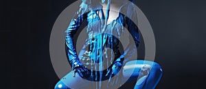 paint drips from the woman body, blue liquid drops on beautiful model girl`s body, creative abstract