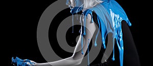 paint drips from the woman body, blue liquid drops on beautiful model girl`s body, creative abstract