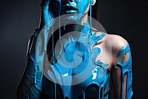 paint drips from the woman body, blue liquid drops on beautiful model girl`s body, creative abstract