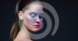 Paint, face and creative woman beauty for feminine expression, unique facial art and abstract dark studio background