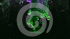 Paint fall into water which is twist. Spin acrylic ink drip into liquid. Visual effect bullet time, frozen moment. Cloud